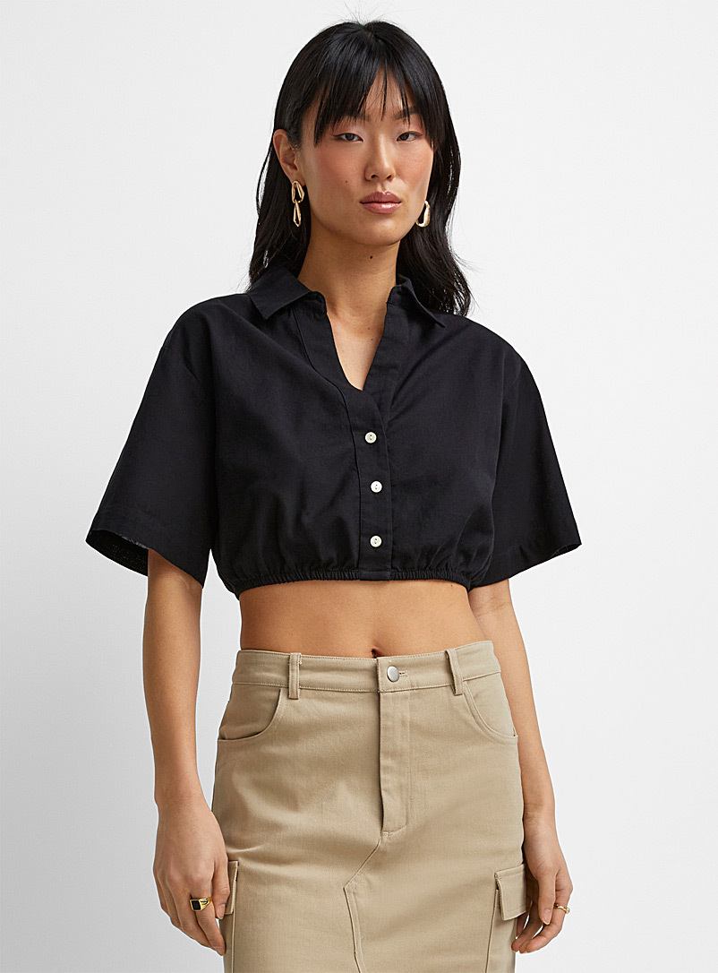 Icône: La blouse courte taille élastique touche de lin Noir pour femme