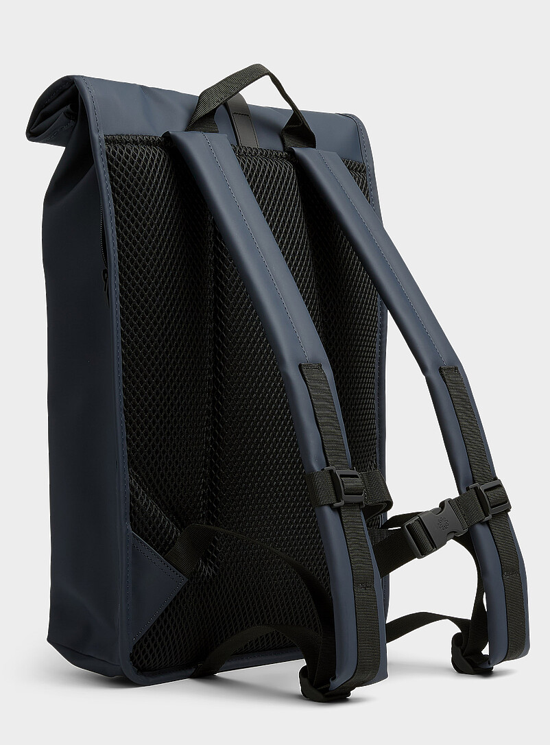 rains men backpack Mini, Black Waterproof Laptop Bag for Women and Men, Small | Small waterproof backpack in black with a 15 in laptop pocket, flap, and carabiner This stylish rucksack from the RAINS Book Daypack series is a must Rains Backpack Mini  MODA
