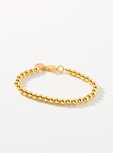 Le bracelet dor&eacute; &agrave; billes