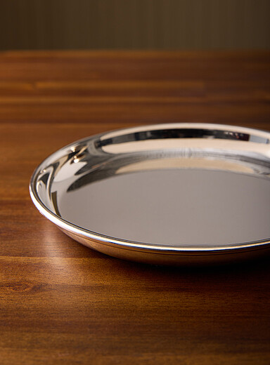 Small round metallic serving tray