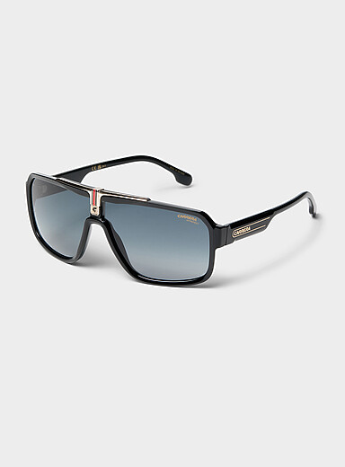 Les lunettes de soleil visi&egrave;re accent dor&eacute;