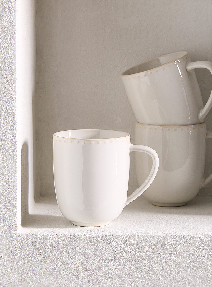 Embossed polka dots white mug product image (primary)