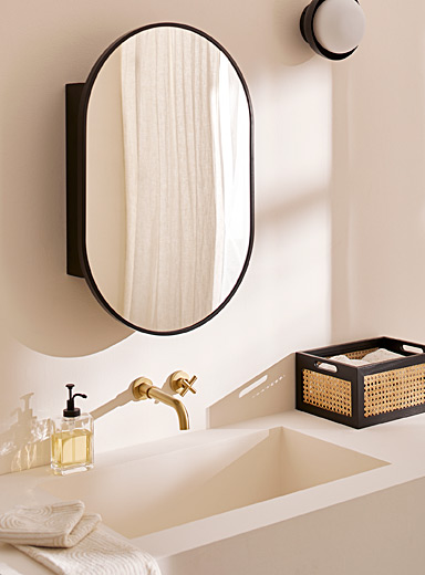 Rounded mirror medicine cabinet