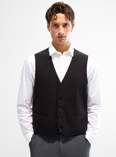 Le gilet uni extensible <b>Coupe relaxe</b>