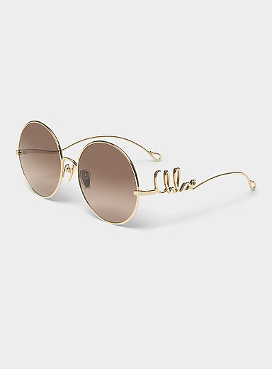 Les lunettes de soleil m&eacute;talliques rondes signature