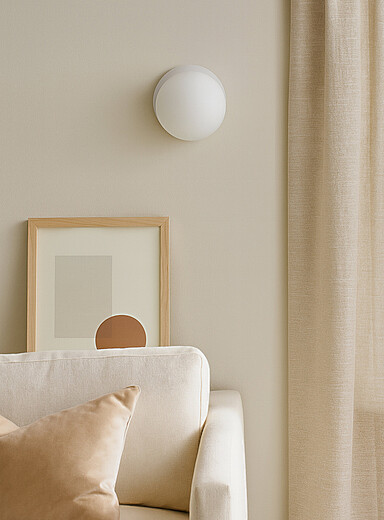 White globe wall sconce