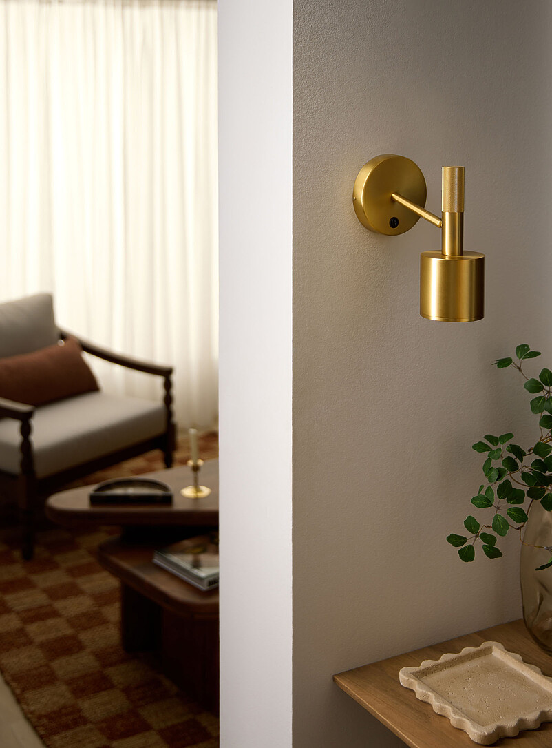 Rhoswen Sleek Brass Finish Wall Sconce
