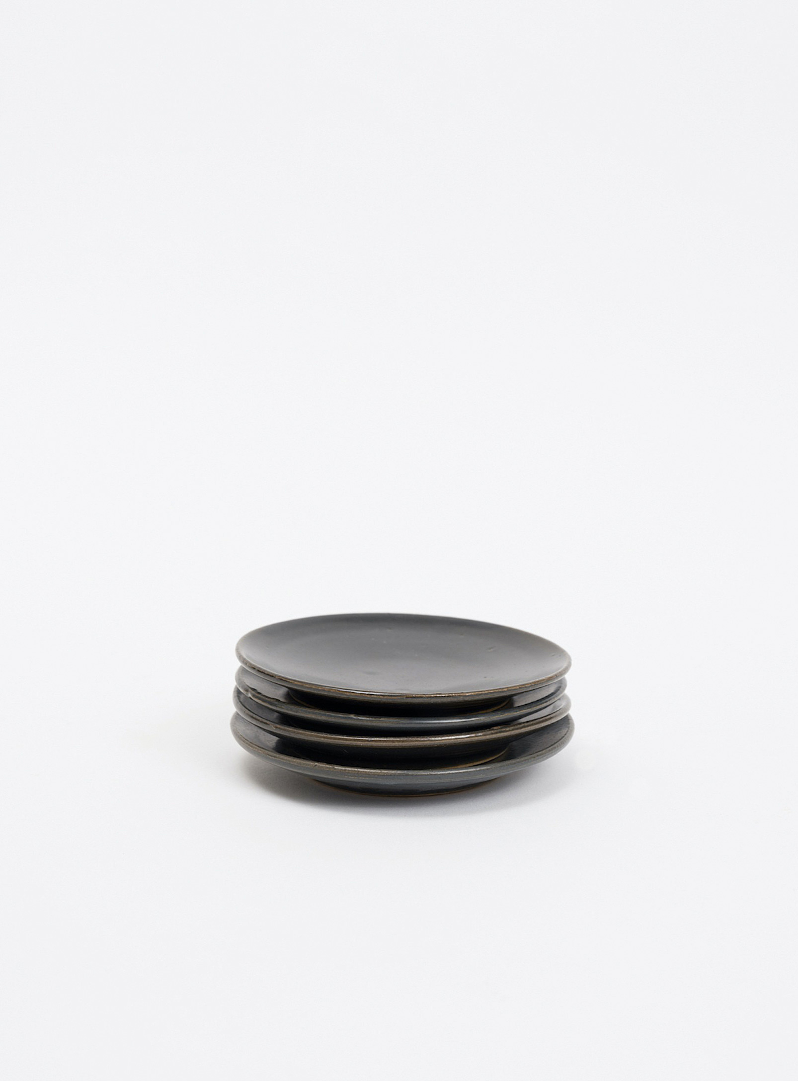 Kate Metten Ceramics Speckled Stoneware Saucer Set Set Of 4 In Black