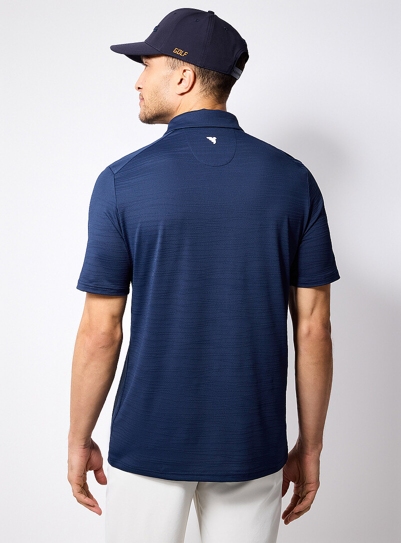 Macade: Le polo de golf microperfor&eacute; trame ray&eacute;e Bleu marine - Bleu nuit pour homme