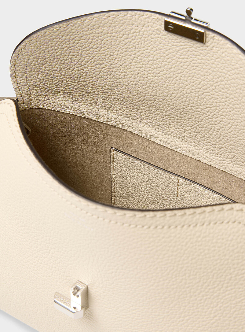 Toteme Ivory/Cream Beige T-Lock grained leather clutch for women