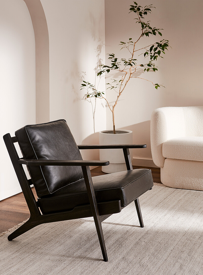 Sleek black leather armchair product image (primary)