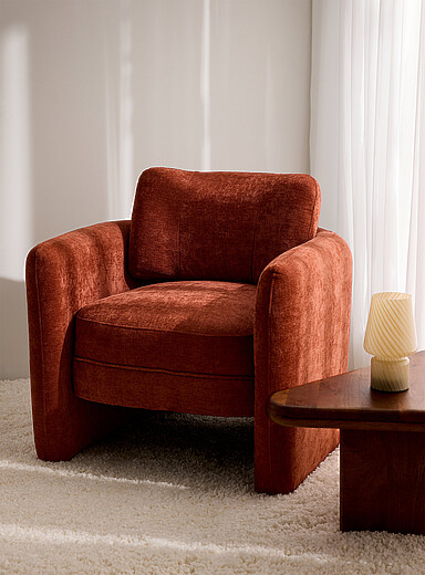Rust brown curved backrest armchair