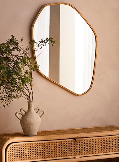 Rattan trim asymmetrical mirror