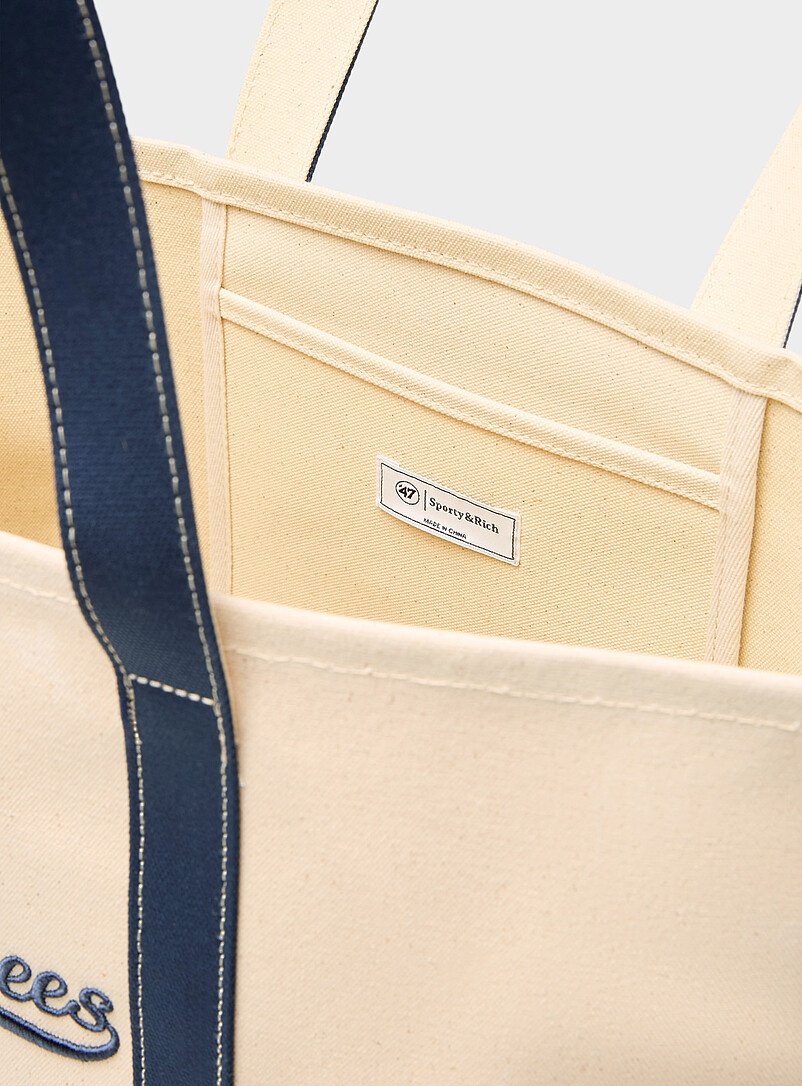 Sporty & Rich: Le fourre-tout en toile Yankees Blanc cass&eacute; pour homme