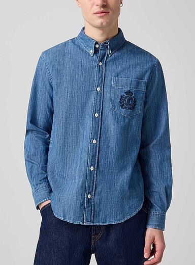 Sporty & Rich: La chemise denim souple logo armoirie Unisexe Bleu p&acirc;le - Bleu ciel pour homme