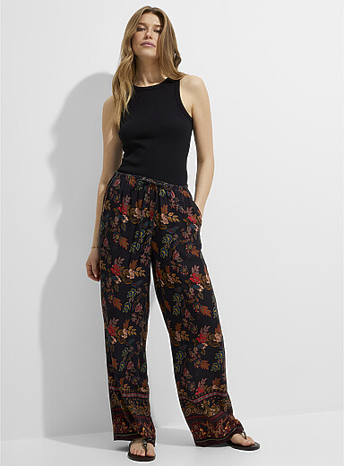 Ic&ocirc;ne: Le pantalon large imprim&eacute; taille cordon Noir &agrave; motifs pour femme