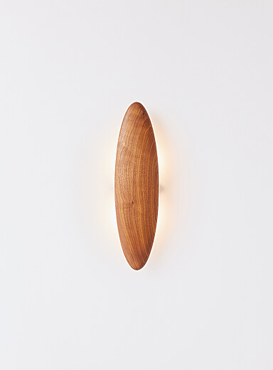 Permanence walnut wall sconce