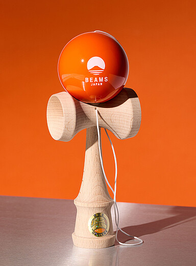 Tangerine ball wooden bilbo-catcher