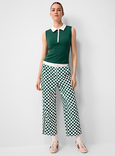 Fore All: Le polo de golf sans manches Tackle Vert pour femme
