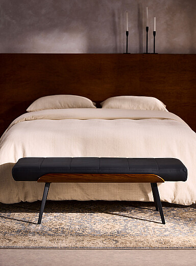 Cushioned bench in topstitched faux leather