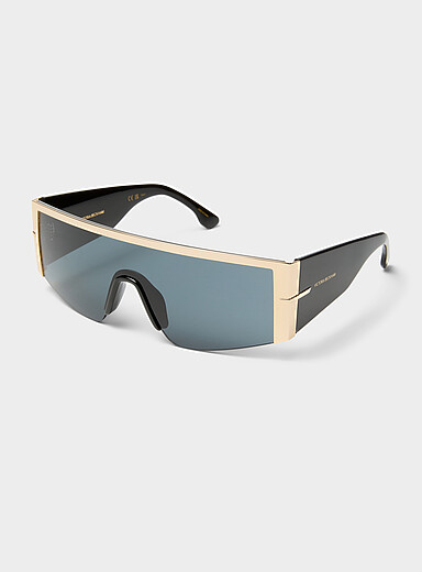Les lunettes de soleil visi&egrave;re dor&eacute;es