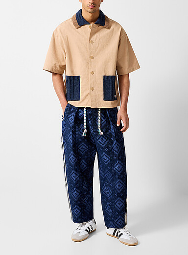 Le pantalon <i>track</i> bandes pointelle Ikat