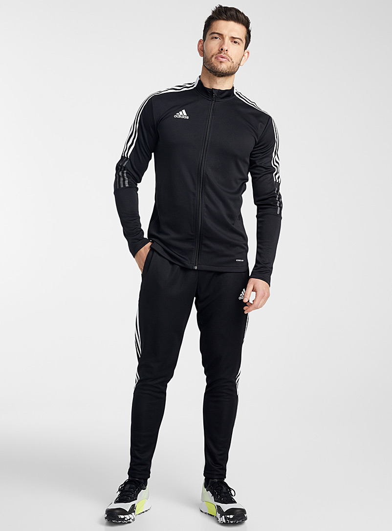 Adidas: La veste de survêtement noir total Tiro Noir pour homme