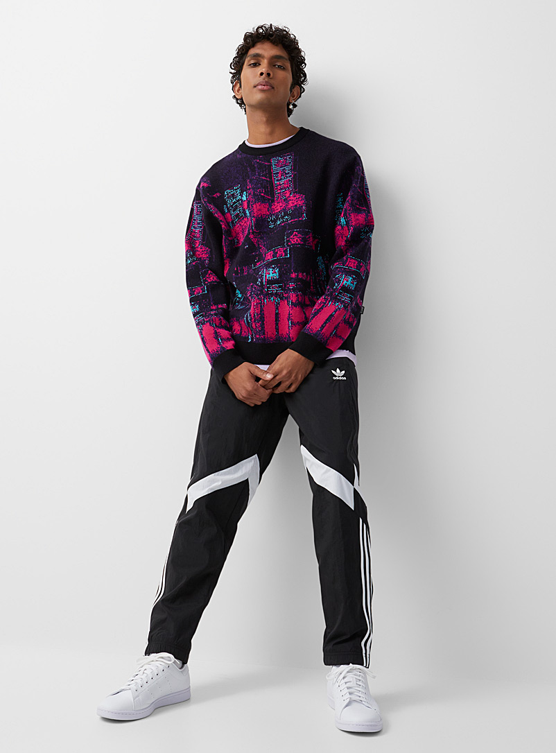 Adidas Originals: Le pantalon track Rekive nylon recyclé Noir pour homme