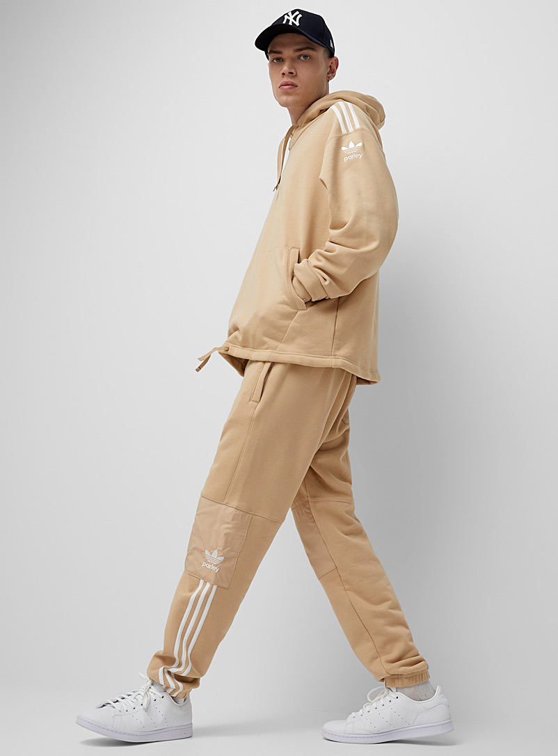 Adidas Originals: Le jogger techno Adicolor Parley Tan beige fauve pour homme