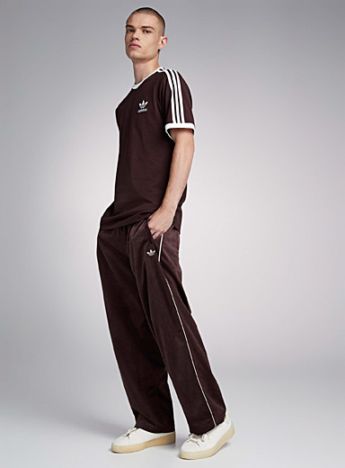Adidas Originals: Le pantalon liséré velours côtelé Coupe ample Brun pour homme