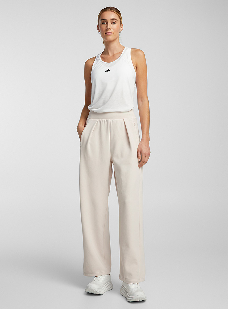 Adidas: Le pantalon large à plis doux jersey Beige crème pour femme