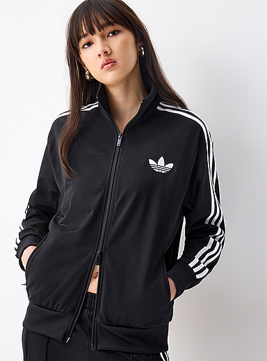La veste <i>track</i> tricot col montant