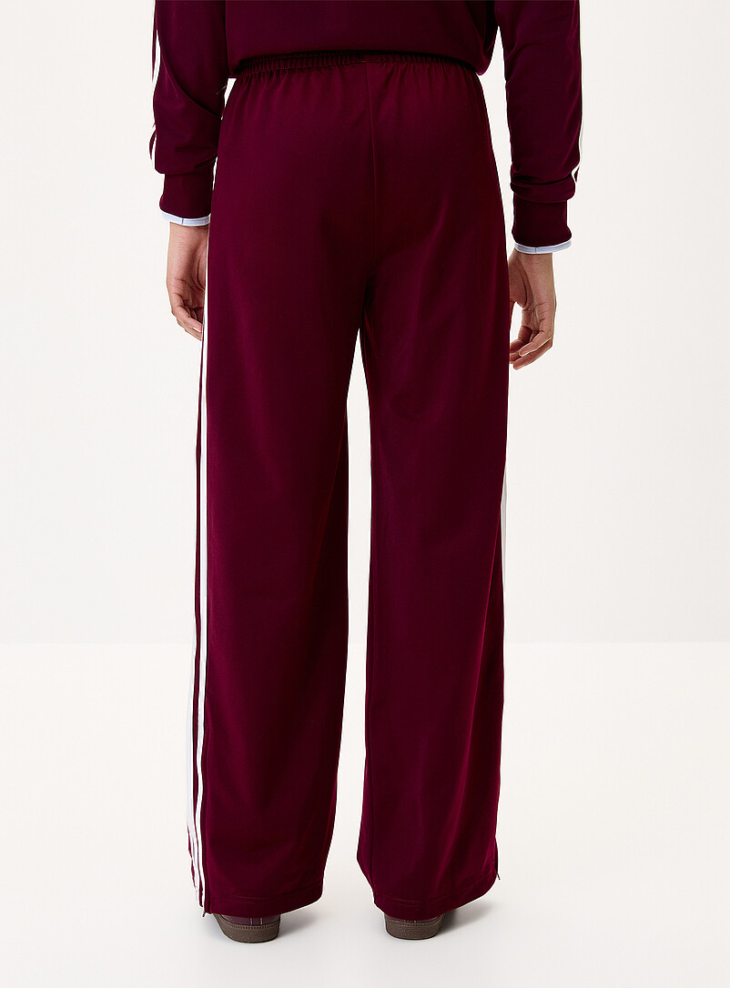 Adidas: Le pantalon <i>track</i> large 3 bandes Bourgogne  pour femme