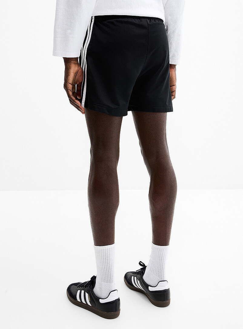 Adidas Originals: Le short <i>track</i> Firebird Noir pour homme