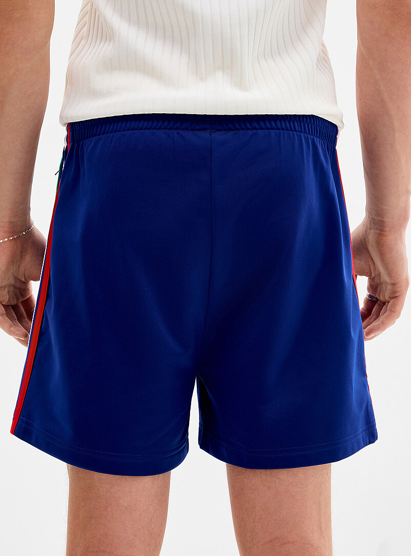 Adidas Originals: Le short <i>track</i> Firebird couleurs r&eacute;tro Vert pour homme