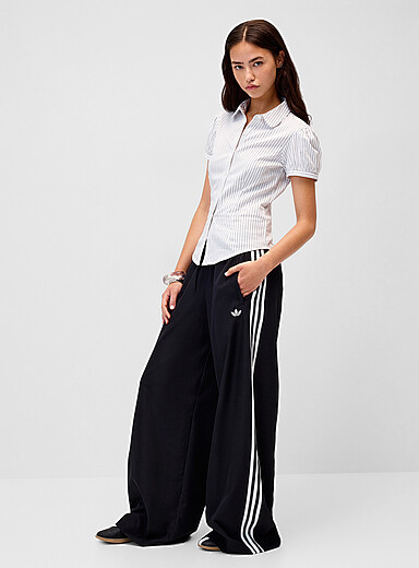 Adidas Originals: Le pantalon <i>track</i> Firebird jambe large Noir pour femme