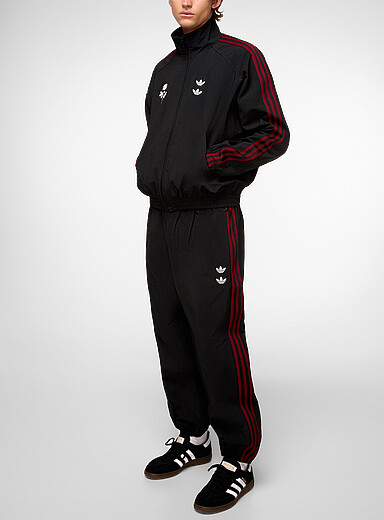 Adidas x Willy Chavarria: Le pantalon <i>track</i> broderie rose Noir &agrave; motifs pour homme
