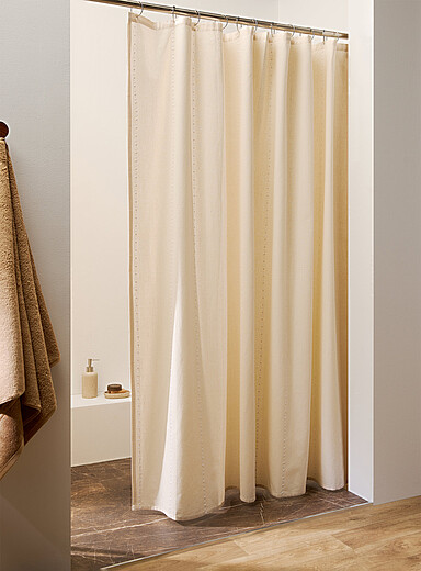 Le rideau de douche rayures ajours floraux