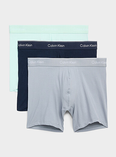 Calvin Klein: Les boxeurs longs menthe/gris/marine 6 po Icon Cotton Stretch Emballage de 3 Blanc &agrave; motifs pour homme