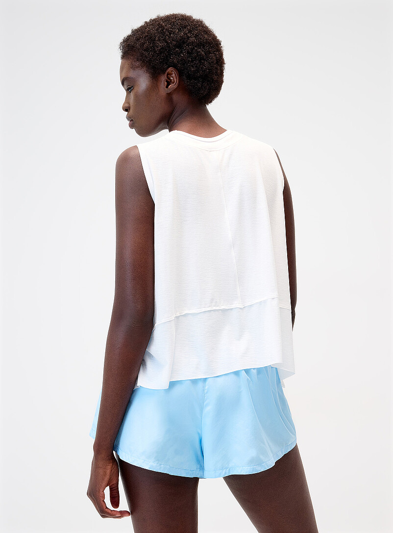 Free People White Tempo asymmetric fluid tank for women