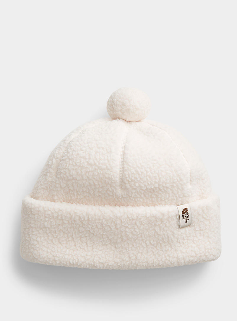 The North Face Ivory White Cragmont polar fleece pompom tuque for women