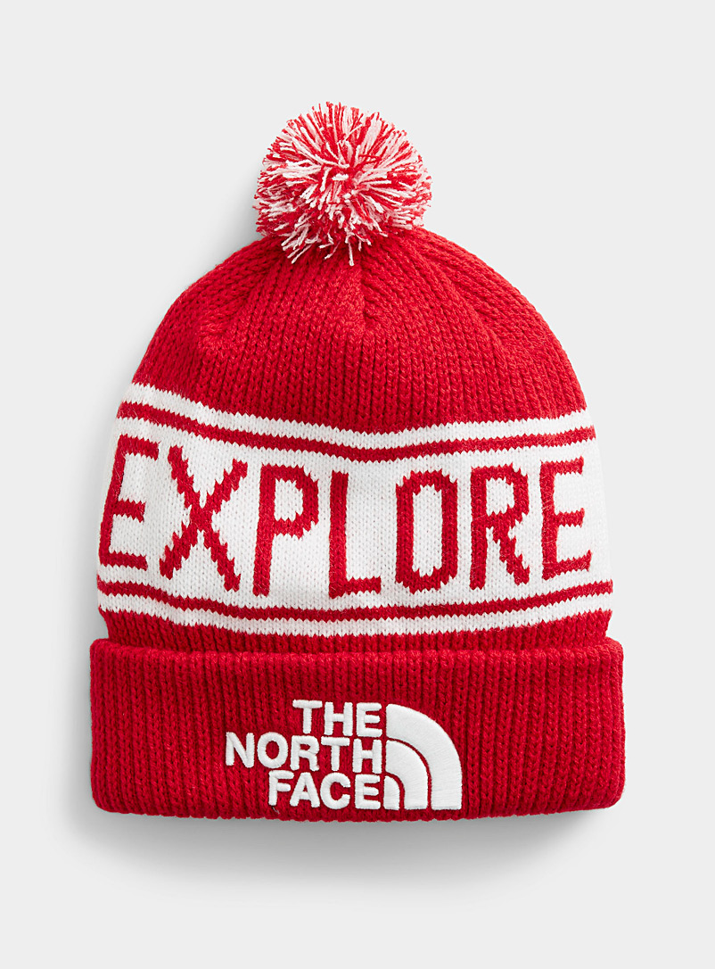 The North Face: La tuque pompon Explore Rouge pour homme