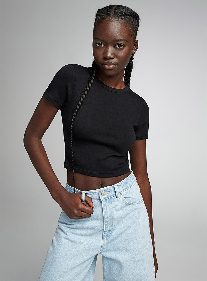 Twik: Le t-shirt mini uni Noir pour femme