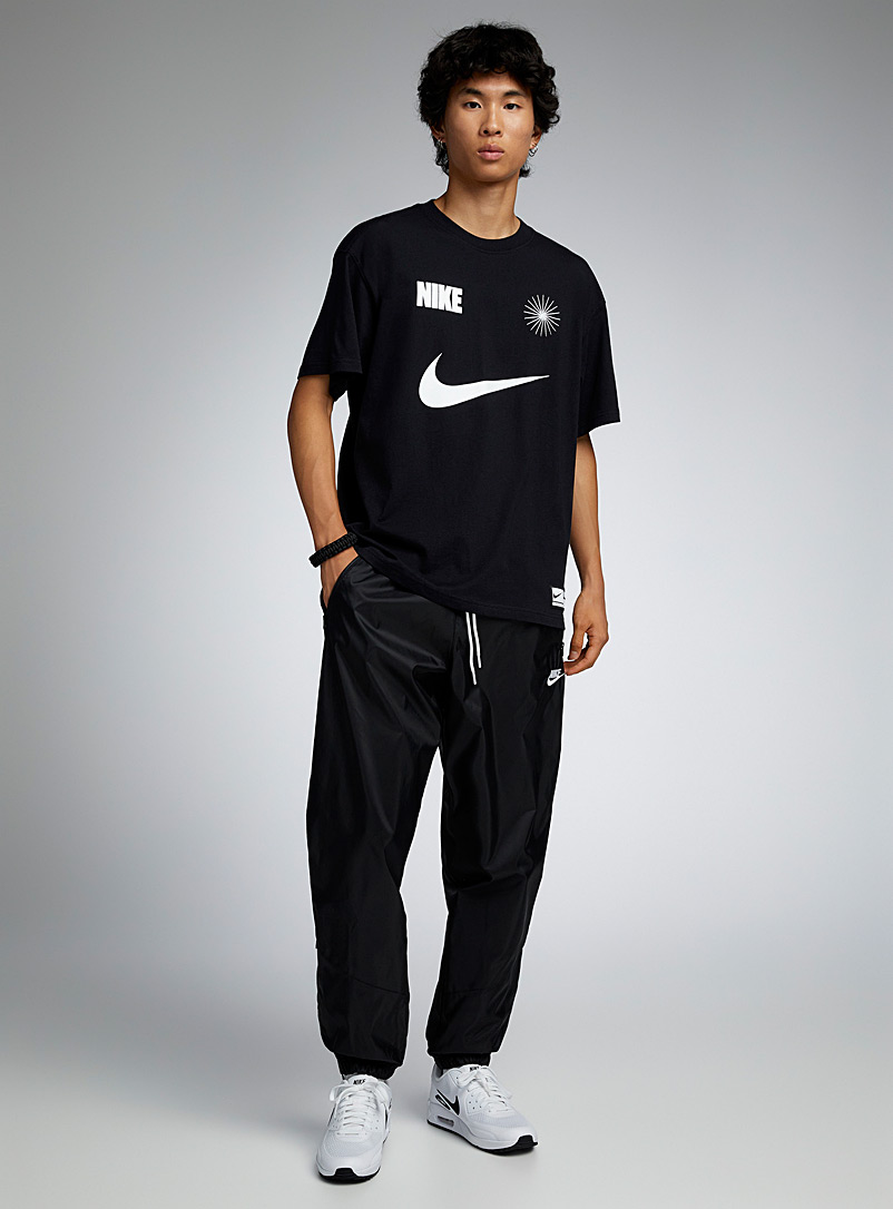 Nike: Le jogger <i>track</i> Windrunner Coupe fuselée Noir pour homme