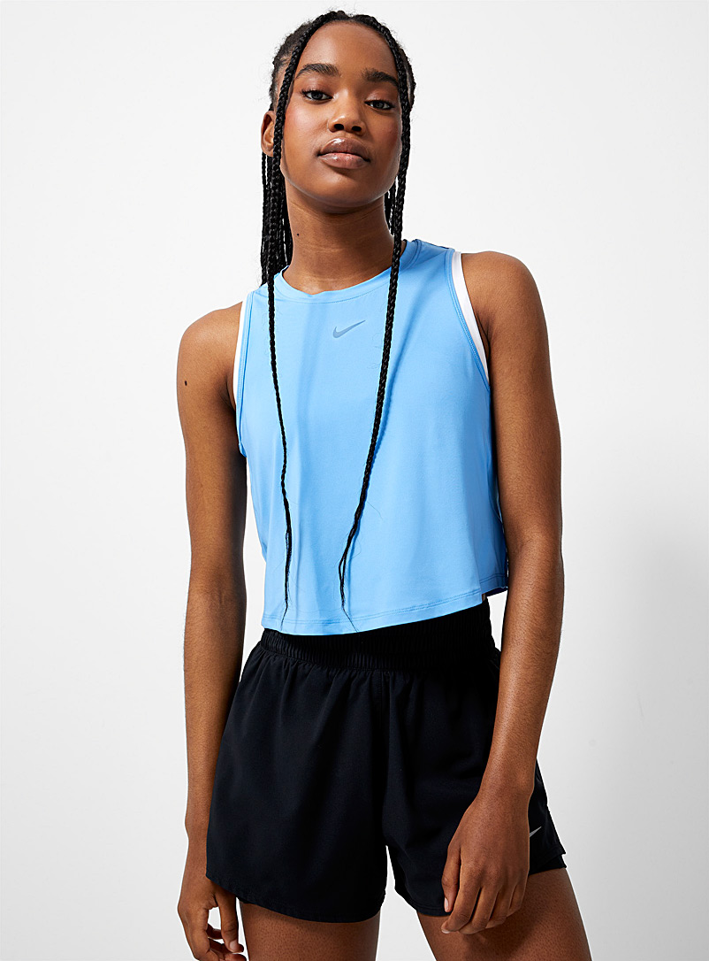 Nike: La camisole courte encolure haute Bleu pour femme
