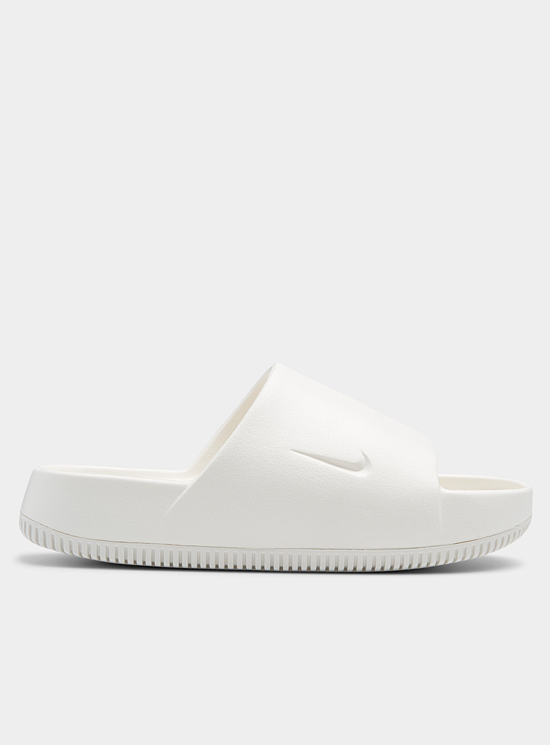 Nike: La sandale slide Calm Femme Blanc pour femme