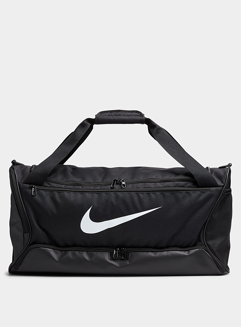 Y'all have ~inspired~ me, a serial over-packer, to take one backpack on my  weekend trip! As far as I can tell this is close to a Nike Brasilia backpack,  I got it
