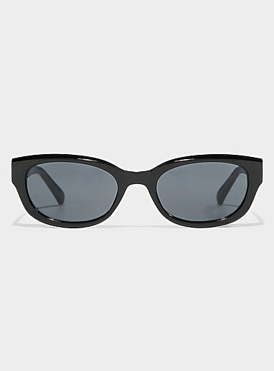 Les lunettes de soleil ovales translucides unies