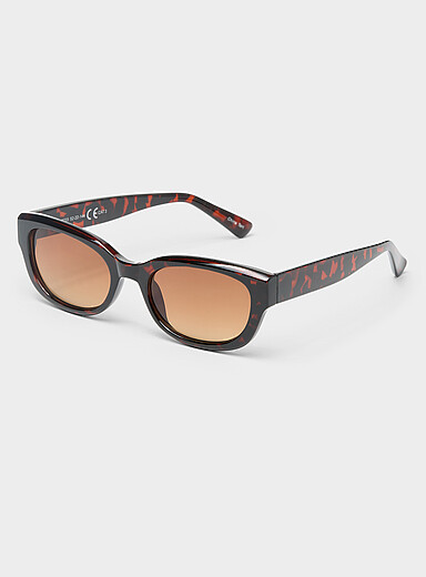 Les lunettes de soleil ovales translucides unies