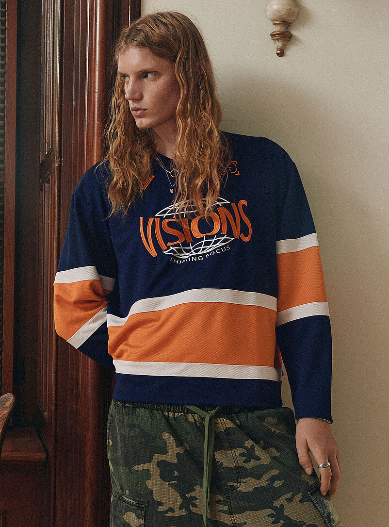 Navy and orange hockey jersey product image (primary)